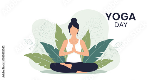 Serene woman practicing yoga in a seated lotus position surrounded by tropical green leaves for international yoga day celebration.