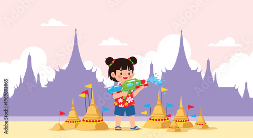 Young girl playing with a water gun during the songkran festival in thailand featuring sand pagodas and temple silhouettes in the back.