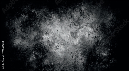 Grungy black and white texture with a soft light center and dark edges