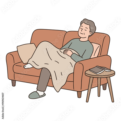A man is relaxing on a sofa with a blanket and laptop nearby.