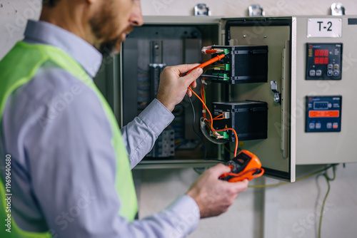 checking voltage control panel screen system at electrical cabinet for generate electricity of factory in manufacture industrial