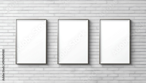 Three blank posters on white brick wall 