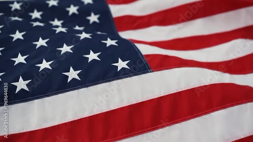 American flag waving in the wind with stars and stripes