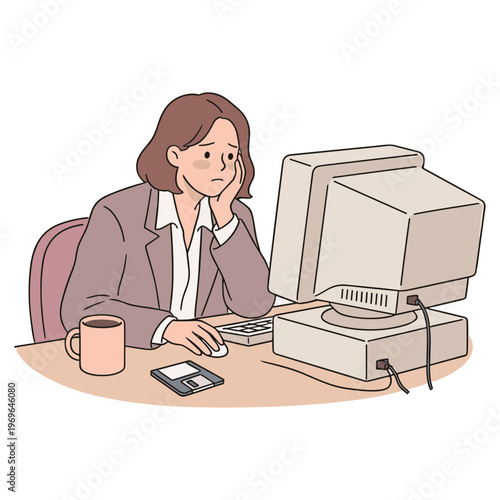 A stressed businesswoman sits at her desk working on a computer.