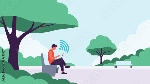 Young man sitting on a bench under a large tree in a park and working on his laptop while connected to a strong wifi signal.