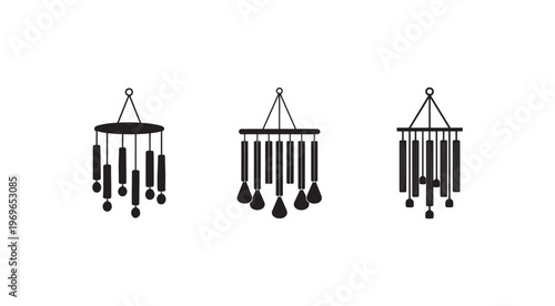 Black silhouette of three different wind chimes with various hanging objects on white background