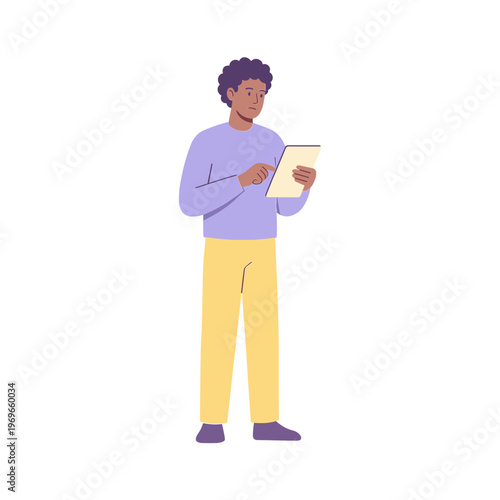 A man stands reading a book with a thoughtful expression indoors