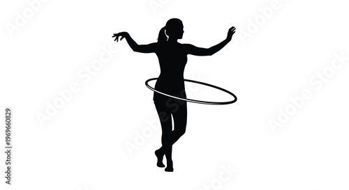 Woman spinning a hula hoop dynamic pose captured in silhouette