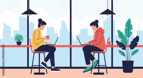 Two young women working on laptops while sitting at a long counter in a cafe with large windows overlooking a city skyline.