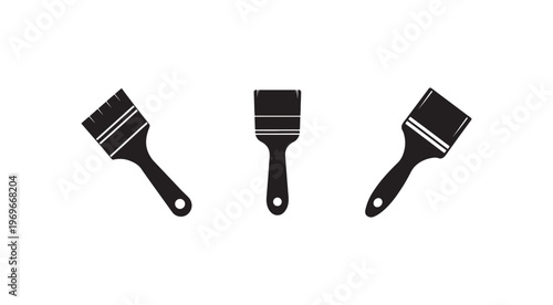 Set of three black paint brushes with white stripes on white background for painting and decorating