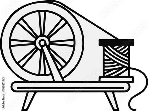 Traditional spinning wheel with spool of thread