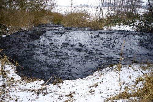 Obraz na płótnie Mudslide in winter on a meadow
