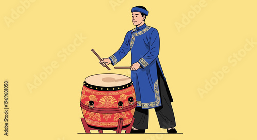 Man in traditional Vietnamese ao dai playing a large drum