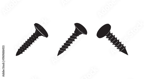Three black screws with ridged shafts and flat heads on white background for fastening materials  industrial and construction tools