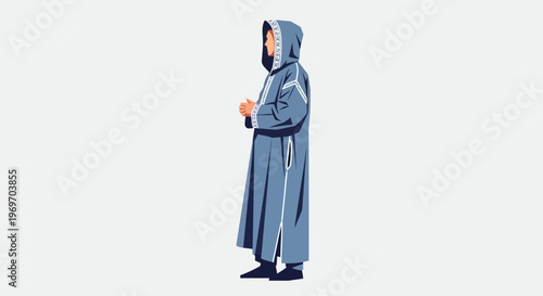 Man in hooded robe standing outdoors