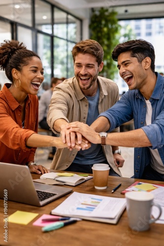 Business team stacking hands together symbolizing teamwork unity collaboration success office environment