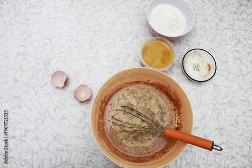 The process of making dough in a bowl. View from above. Copyspace