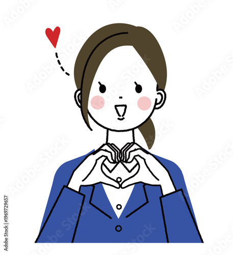 紺色のスーツを着た若い女性　手でハートのジェスチャーをしている笑顔の女性