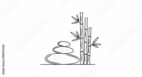 Stacked smooth stones and tall bamboo stalks with delicate leaves
