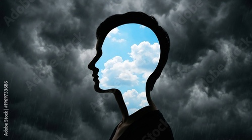 Wallpaper Mural Silhouette of a person's head revealing a bright sky with clouds inside, contrasting with a dark, stormy background symbolizing inner thoughts. Torontodigital.ca