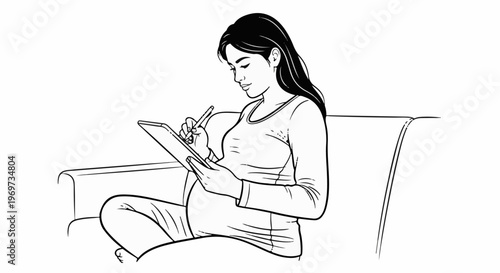 Pregnant woman sitting on a couch using a stylus on a tablet