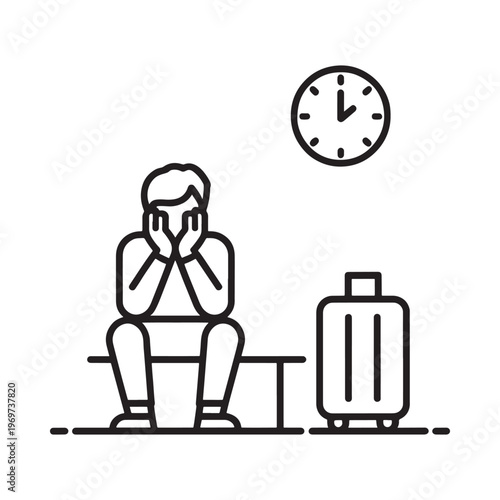A distressed man sits with his head in hands near a suitcase and clock