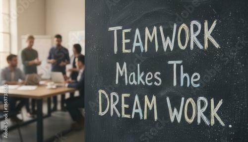 Motivational Teamwork Quote on Chalkboard in Office Setting with Colleagues Collaborating and Engaging in Discussion