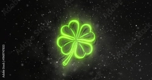 Glowing neon green four-leaf clover showing tubular outline and halo in studio with floating dots