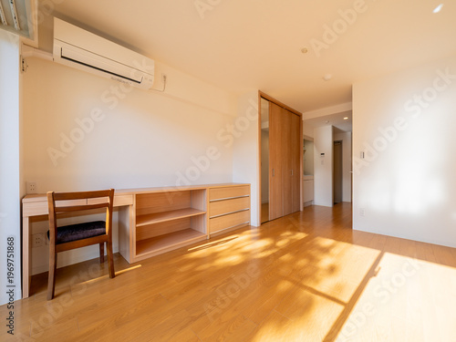 interior of student-friendly one-room apartment with desk and storage