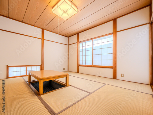 Traditional Japanese tatami room with shoji windows and sunken table