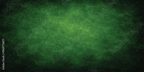 Grunge green textured background with vintage rays on an aged rough wall surface