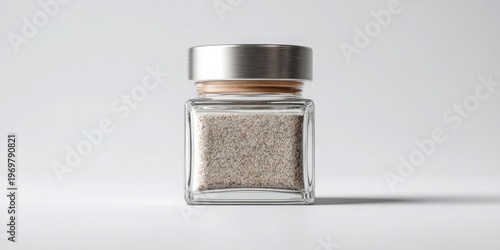 A glass jar filled with spices, perfect for culinary use during any festive occasion. A spice jar mockup