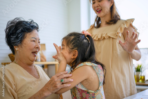 Quadro su tela Daughter, mother and grandmother are preparing food together in the kitchen