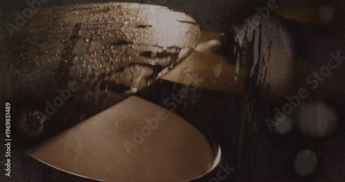 Camera shifting right and down, revealing stacked metallic discs for cinematic use, droplets, rim