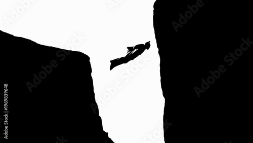 Silhouette of a person jumping between cliffs, extreme sports, freedom, adventure, risk