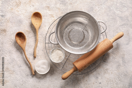 Colander with kitchen utens...