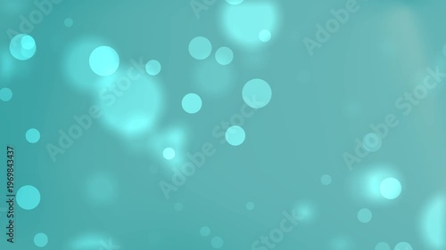 Teal bokeh light circles blend in soft focus. Suitable for backgrounds, presentations, and website design projects. Advertising and marketing materials.