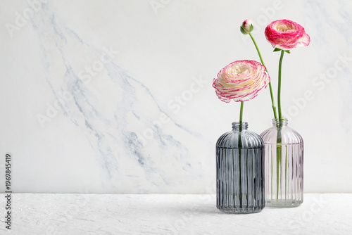 Vases with pink ranunculus ...