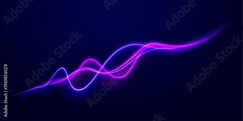 Abstract road light trails glow in darkness. Colorful streaks form smooth motion lines. The scene feels modern and energetic.