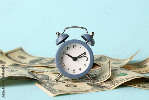 Alarm clock with money on b...