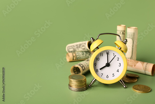 Alarm clock with money on g...