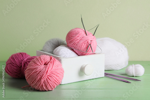 Box with knitting yarn and ...