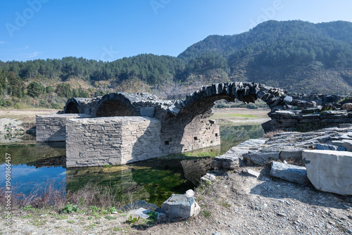 Wallpaper Mural Close-up of a weathered ancient stone arch bridge Torontodigital.ca
