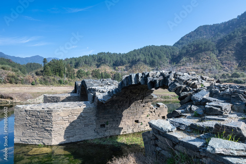 Wallpaper Mural Close-up view of a weathered ancient stone arch bridge Torontodigital.ca
