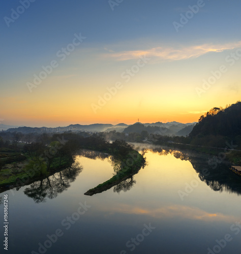 Wallpaper Mural Golden Sunrise Over a Serene River Valley with Misty Mountains and Reflections Torontodigital.ca