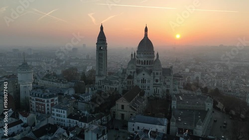 orbiting drone shot of a tourist landmark in the morning in Montmartre, Paris, aerial view of capital of France, Paris. 