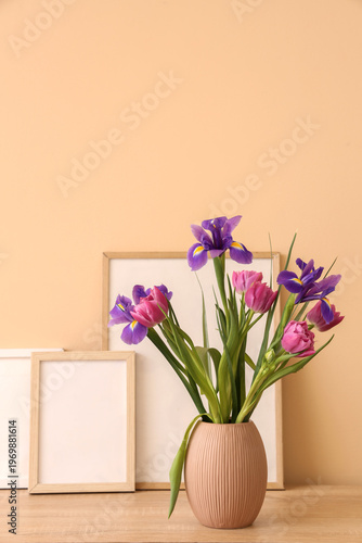 Vase with spring flowers an...