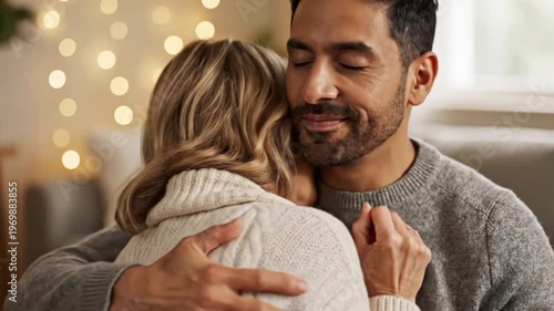 Man and woman embracing intimately indoors with bokeh lights