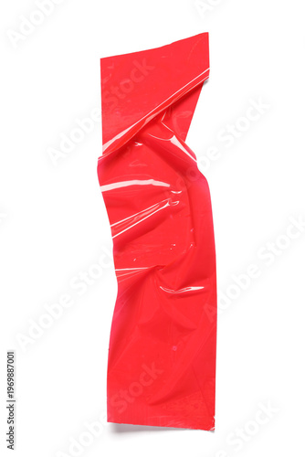 Crumpled strip of red adhes...