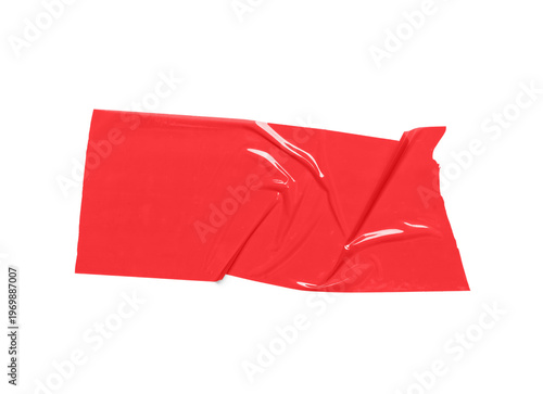 Crumpled strip of red adhes...